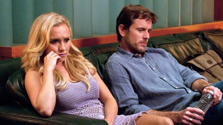 Juliette Barnes and Deacon Claybourne looking glum on a sofa in "Nashville"