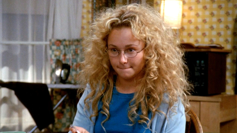 Jessica, arms crossed, at the dinner table