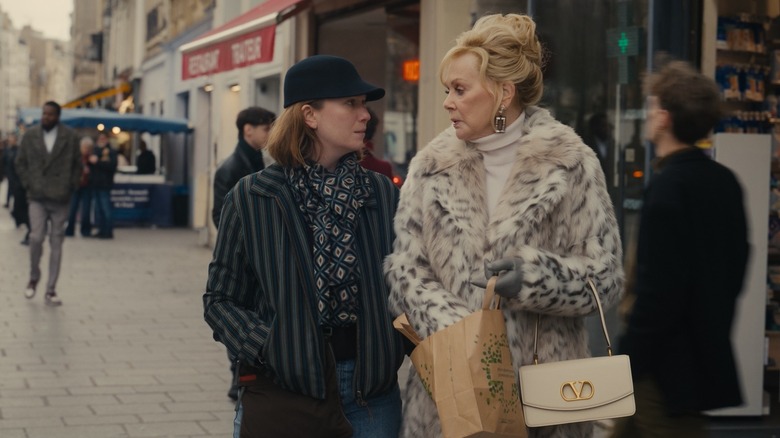 Hannah Einbinder and Jean Smart stand on a busy street in Paris as their characters on "Hacks"