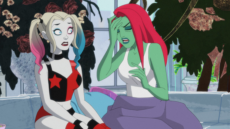 Harley Quinn and Poison Ivy sit next to each other in the animated series.