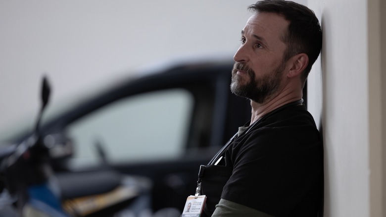 Noah Wylie's charachter on "The Pitt" sits back reflecting on another day at the trauma center.