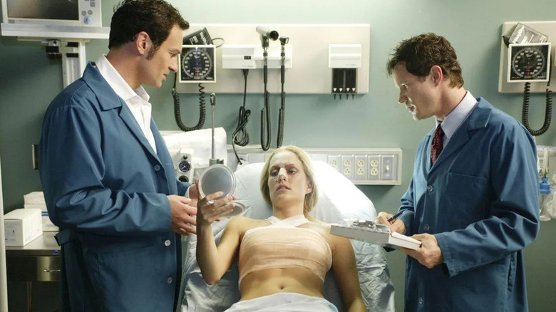 Dr. Sean McNamara and Dr. Christian Troy talking to a patient after surgery in Nip/Tuck