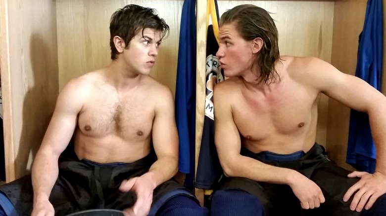 Riley and Jonesy looking at each other shirtless in locker room on Letterkenny