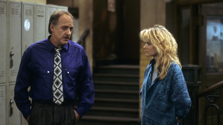 Howard Hesseman as Charlie and Suzanne Snyder as Nancy in the school hallways of Head of the Class