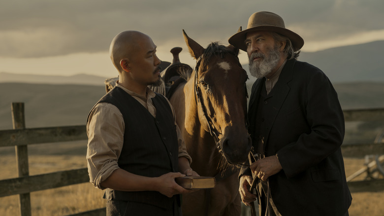 Lee and Samuel Hamilton stand beside a horse in "East of Eden" (2026)