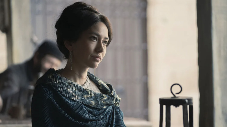 Sonoya Mizuno as Mysaria slightly smiling with her hair up in House of the Dragon