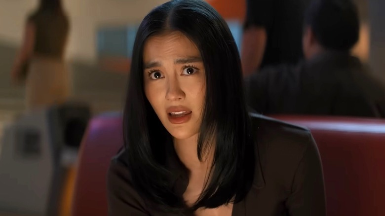 Lila Hoth sitting in a restaurant booth in "Reacher" Season 4