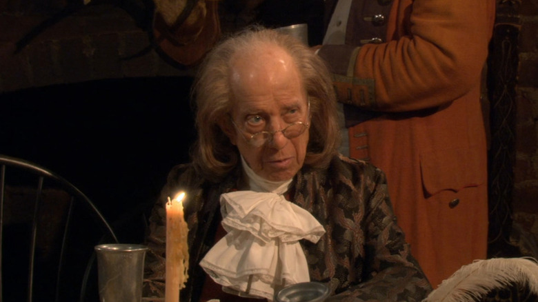 Ian Abercrombie as Ben Franklin peering over glasses in How I Met Your Mother