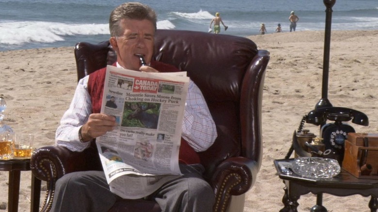 Alan Thicke reading a newspaper on the beach in "How I Met Your Mother" Season 3 episode, "Sandcastles in the Sand."