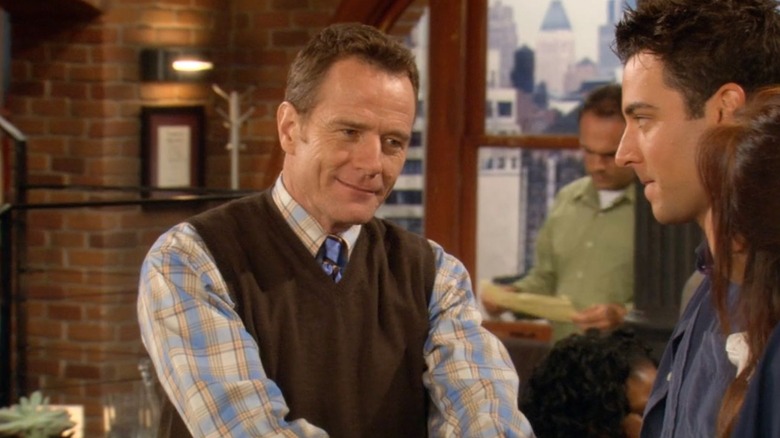 Hammond Druthers (Bryan Cranston) greeting Ted (Josh Radnor) and Lily (Alyson Hannigan) in "How I Met Your Mother."