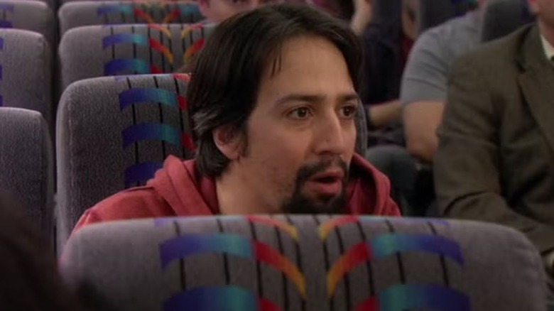 Lin-Manuel Miranda sitting on a bus in "How I Met Your Mother" Season 9.