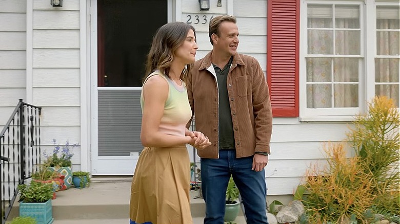 Sofi and Jimmy talking in front of a house in Shrinking