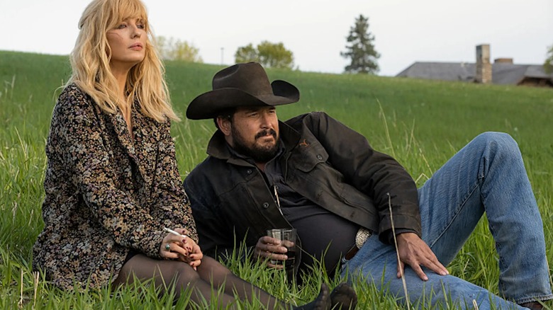 Rip Wheeler in a field with Beth Dutton