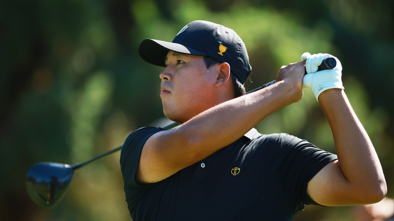 Si Woo Kim teeing off at Presidents Cup in 2024