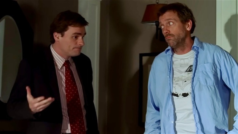 Wilson gestures while House gives him a skeptical look