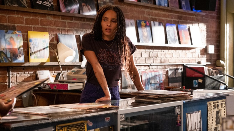 Rob (Zoe Kravitz) working behind the counter at Championship Vinyl on High Fidelity
