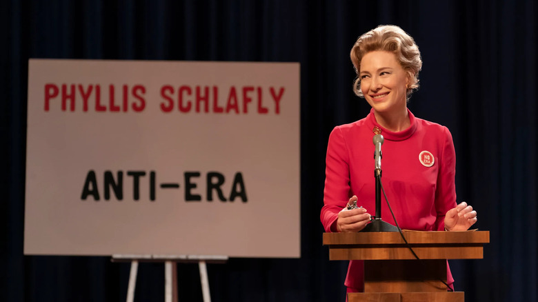 Phyllis Schlafly (Cate Blanchett) in front of a sign against the ERA on Mrs. America