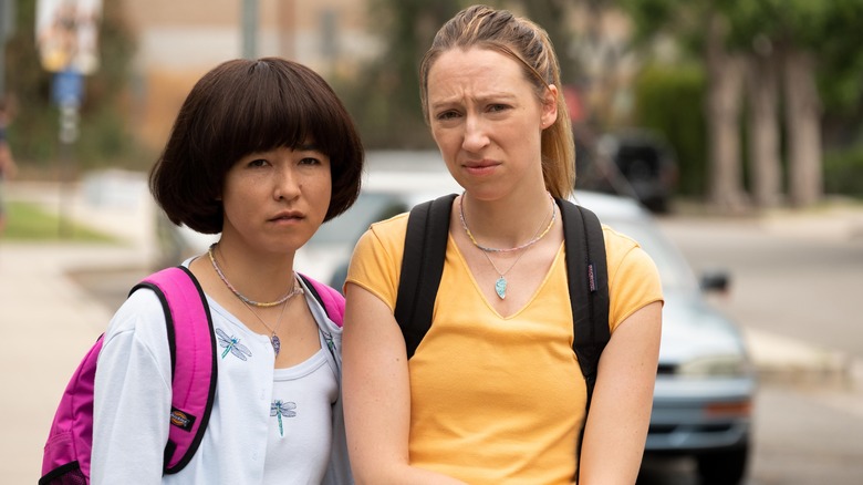 Maya (Maya Erskine) and Anna (Anna Konkle) outside frowning at something on PEN15