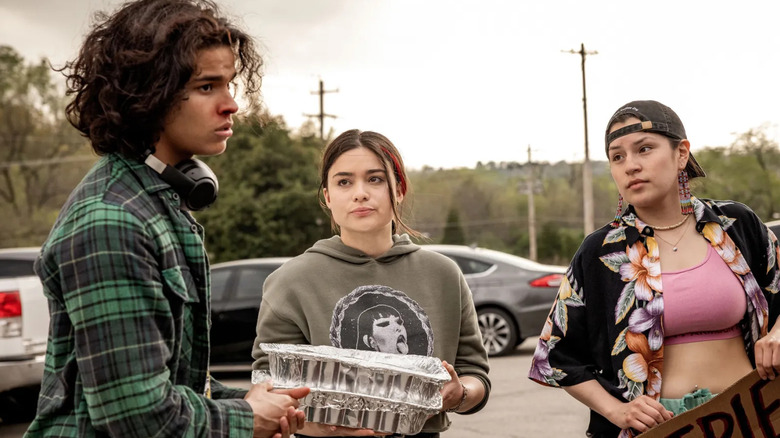 Elora (Devery Jacobs), Bear (D'Pharaoh Woon-A-Tai), and Willie Jack (Paulina Alexis) standing outside talking on Reservation Dogs