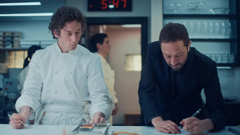 Carmy (Jeremy Allen White) and Richie (Ebon Moss-Bachrach) working in the kitchen on The Bear