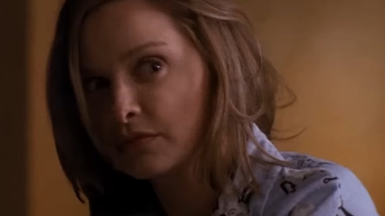 Ally McBeal dances in her pajamas with the translucent CGI baby in "Ally McBeal"