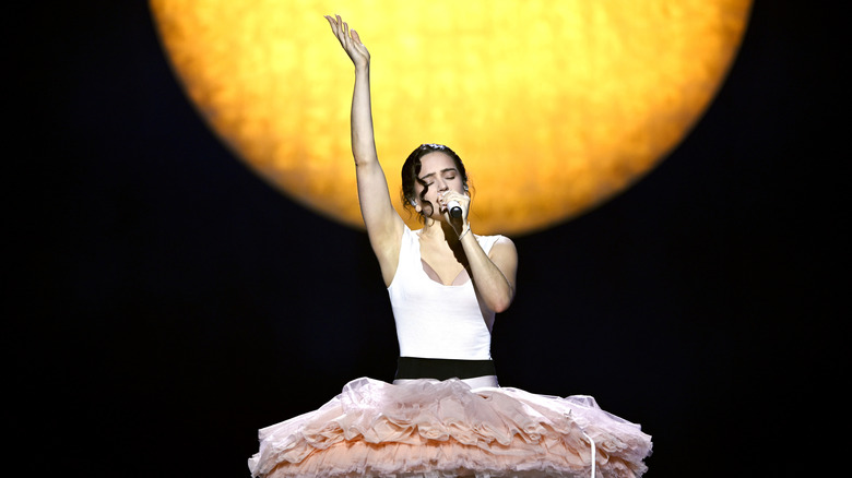 Rosalía performs on stage in 2026