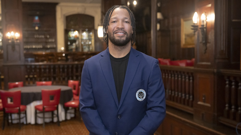 Jalen Brunson wearing a blue suit jacket
