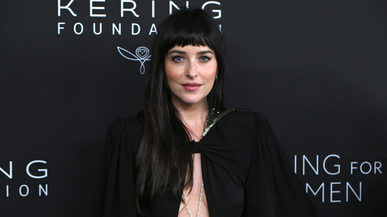 Dakota Johnson wearing a black gown