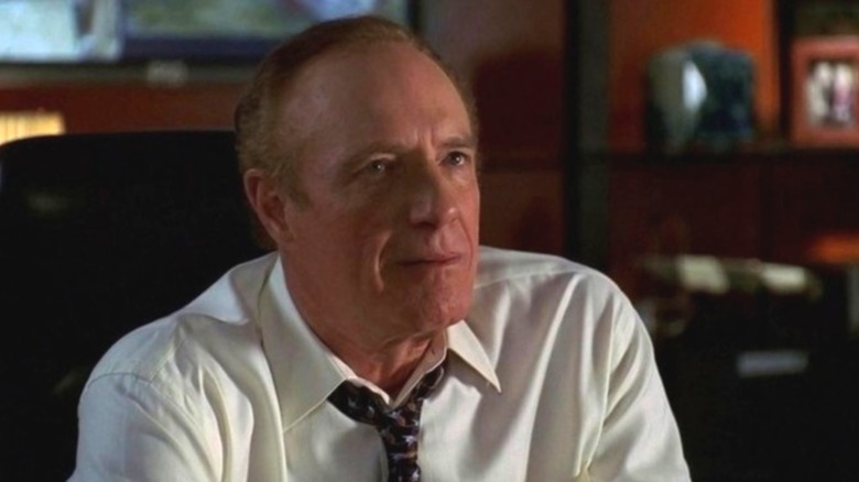 James Caan as Ed Deline wearing suit and tie, sitting in office, in Las Vegas