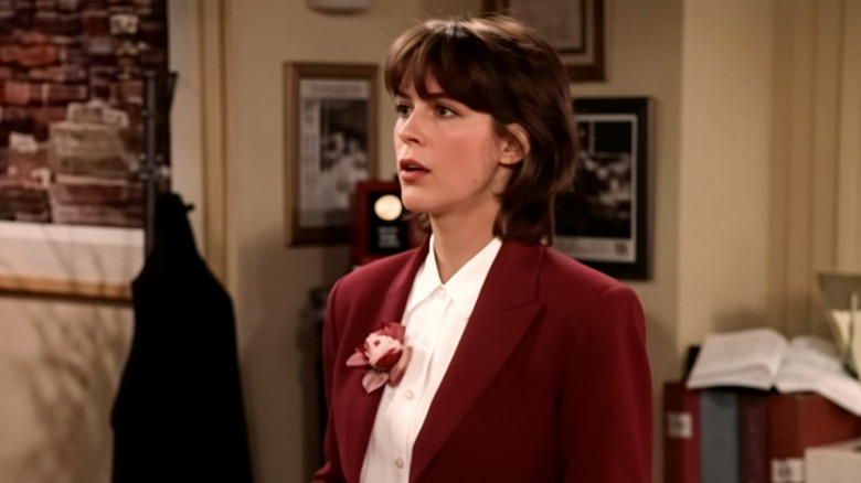 Hannah (Jamie Lee Curtis) standing in an office on "Anything But Love"