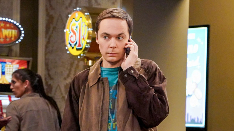 Sheldon (Jim Parsons) holding a cell phone to his ear on "The Big Bang Theory."
