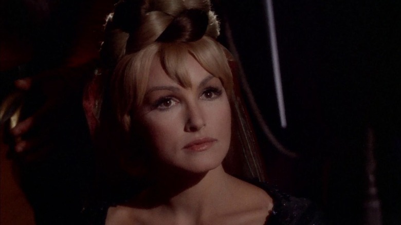 Eleen wearing formal clothes in a dark room in "Star Trek" (1966)