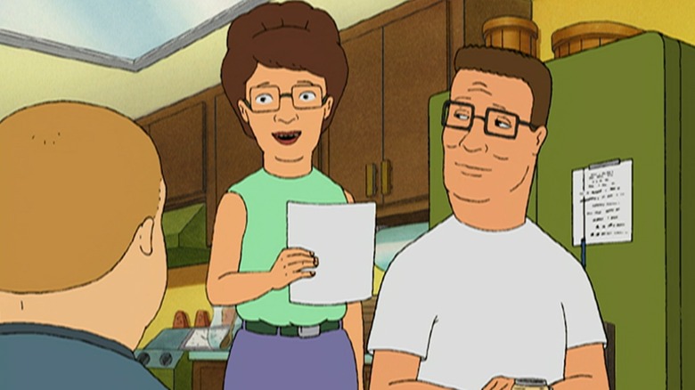 Peggy e Hank Hill conversando com Bobby Hill em King of the Hill