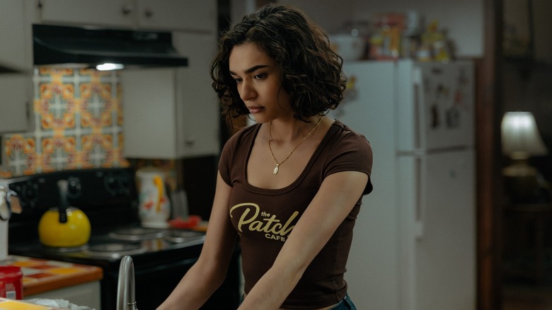 Paulina Chavez as Ariana stands in a kitchen in Landman