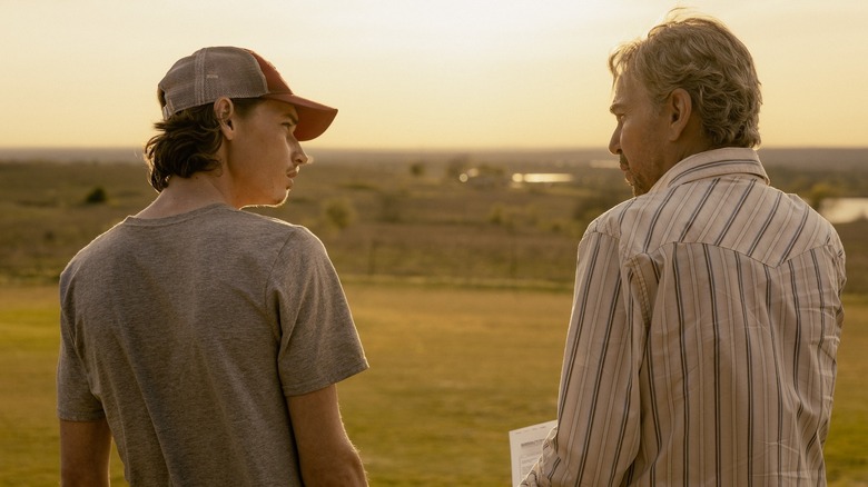 Jacob Lofland as Cooper and Billy Bob Thornton as Tommy look at each other with concern in Landman
