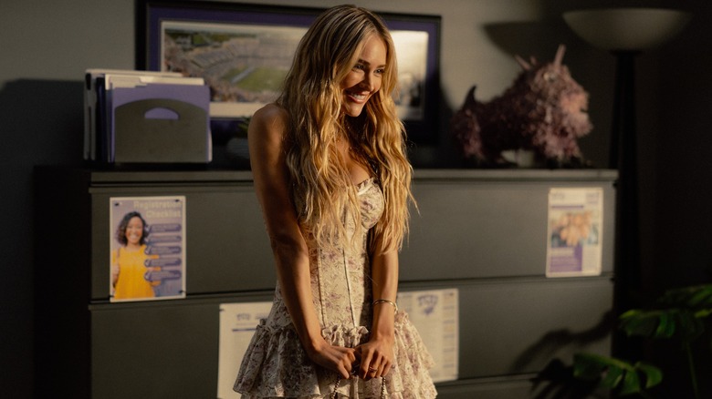 Ainsley looks very happy in a college admissions office in Landman Season 2, Episode 1