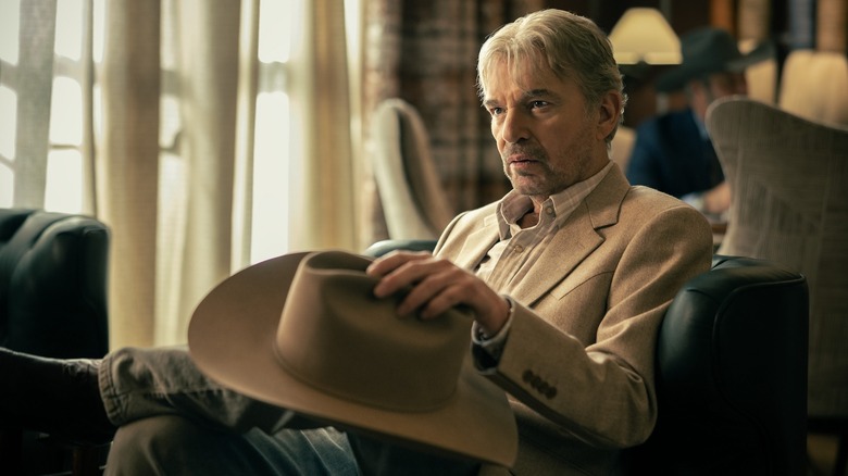 Tommy sits with his cowboy hat on his knee in Landman Season 2, Episode 1