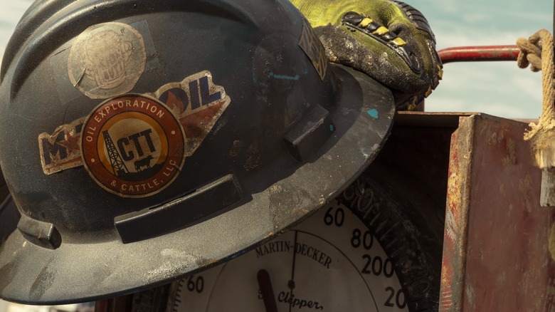 A hard hat with a CTT Oil Exploration & Cattle LLC sticker on it
