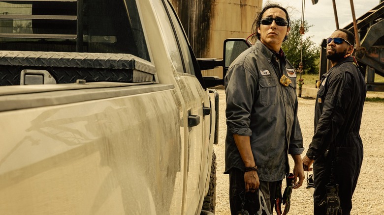 Dougie Hall as King and Mustafa Speaks as Boss wear sunglasses and look up in Landman