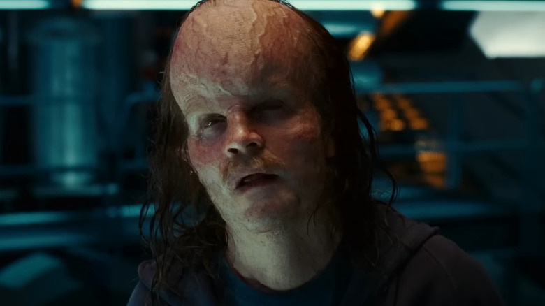 Peter Sarsgaard as Hector Hammond, looking up in a lab in Green Lantern.