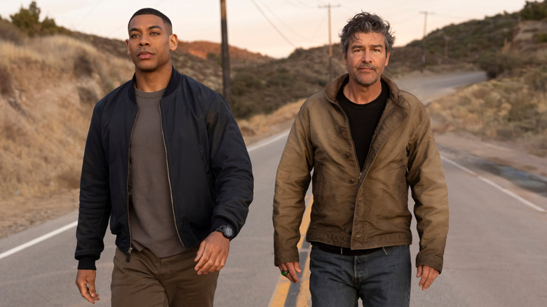 John Stewart (Aaron Pierre) and Hal Jordan (Kyle Chandler) walking together in Lanterns