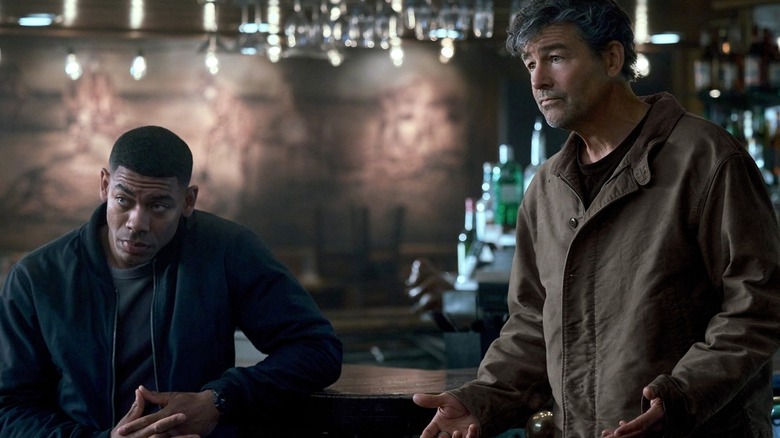 John Stewart and Hal Jordan in a bar, looking on