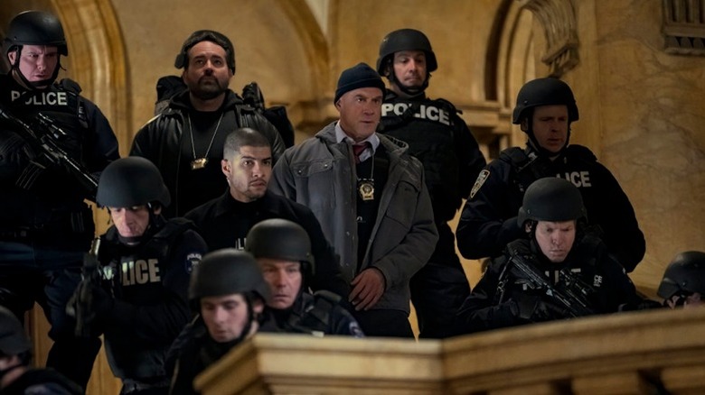 Chris Meloni and some uniformed police officers in Law and Order Organized Crime Season 5