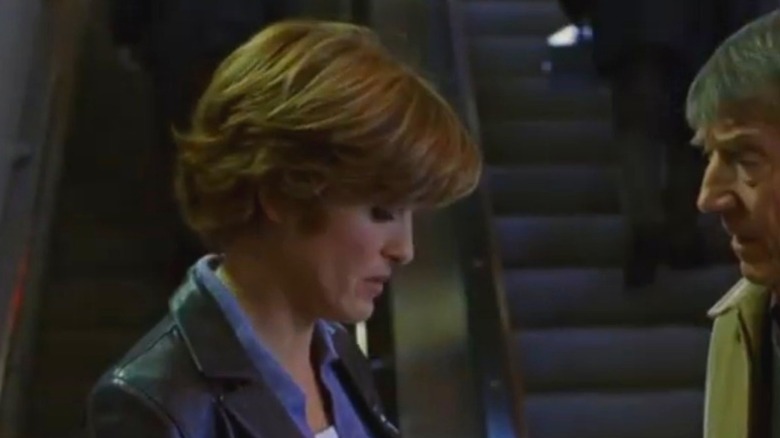 Detective Olivia Benson (Mariska Hargitay) interviewing her Mickey Hargitay next to an escalator in "Law and Order: SVU."