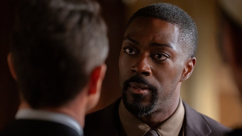 David Ajala as Theo Walker looks intently at Hugh Dancy as ADA Nolan Price in Law and Order