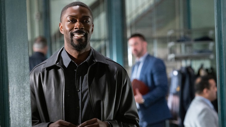 David Ajala as Det. Walker smiles in the squad room on Law and Order