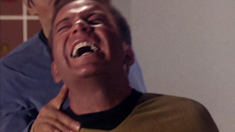 Spock uses the Vulcan nerve pinch on an Enterprise crew member in "Star Trek: The Original Series" (1966)