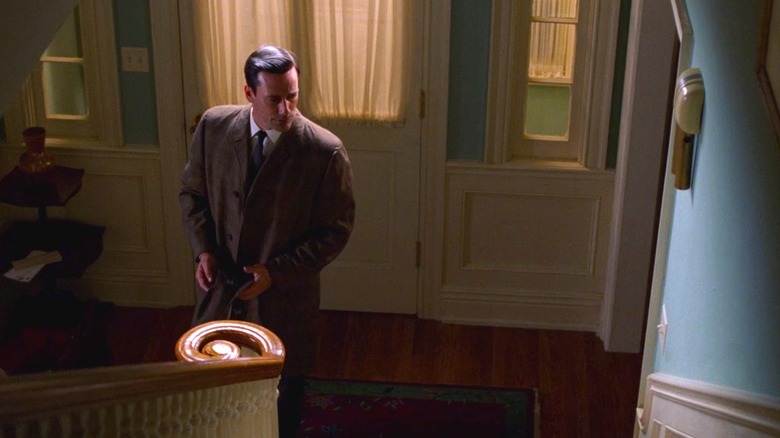 Don Draper stands alone in his home in "The Wheel"