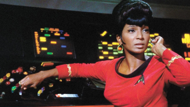 Nyota Uhura (Nichelle Nichols) donning a red shirt in "Star Trek: The Original Series"
