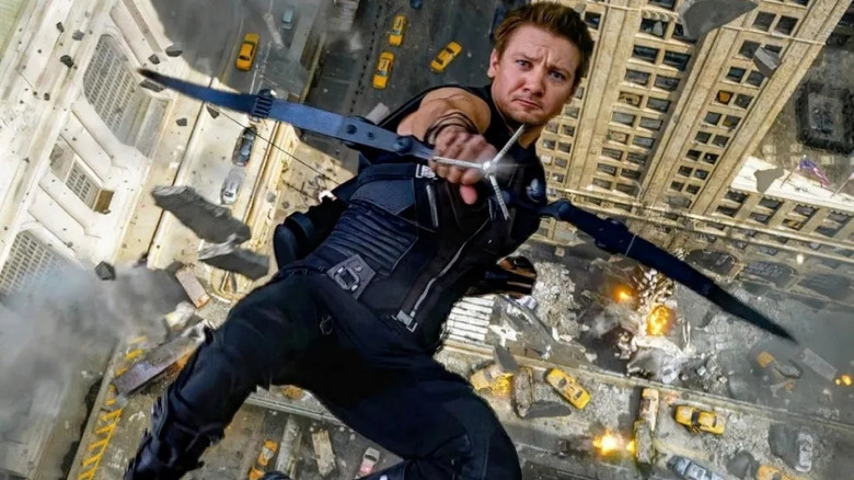 Hawkeye (Jeremy Renner) falling backward while firing an arrow in "The Avengers."